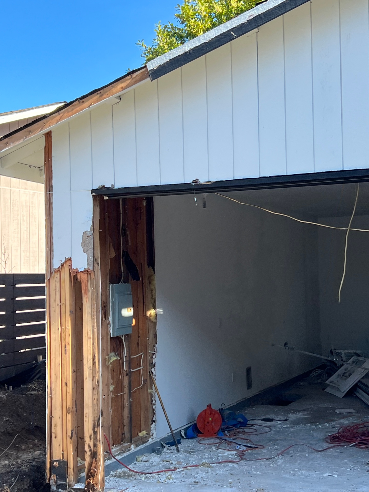 Exterior wall opened up during a garage tearout