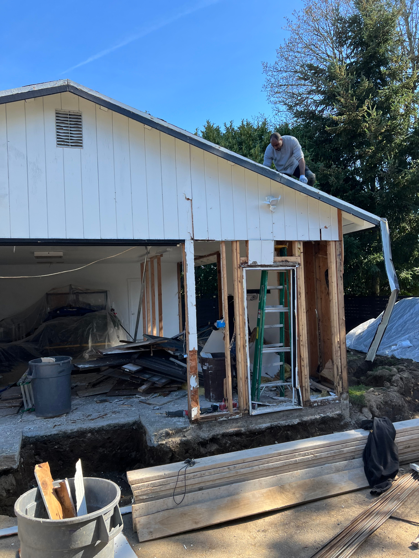 Crew removing an old structure during a property cleanup