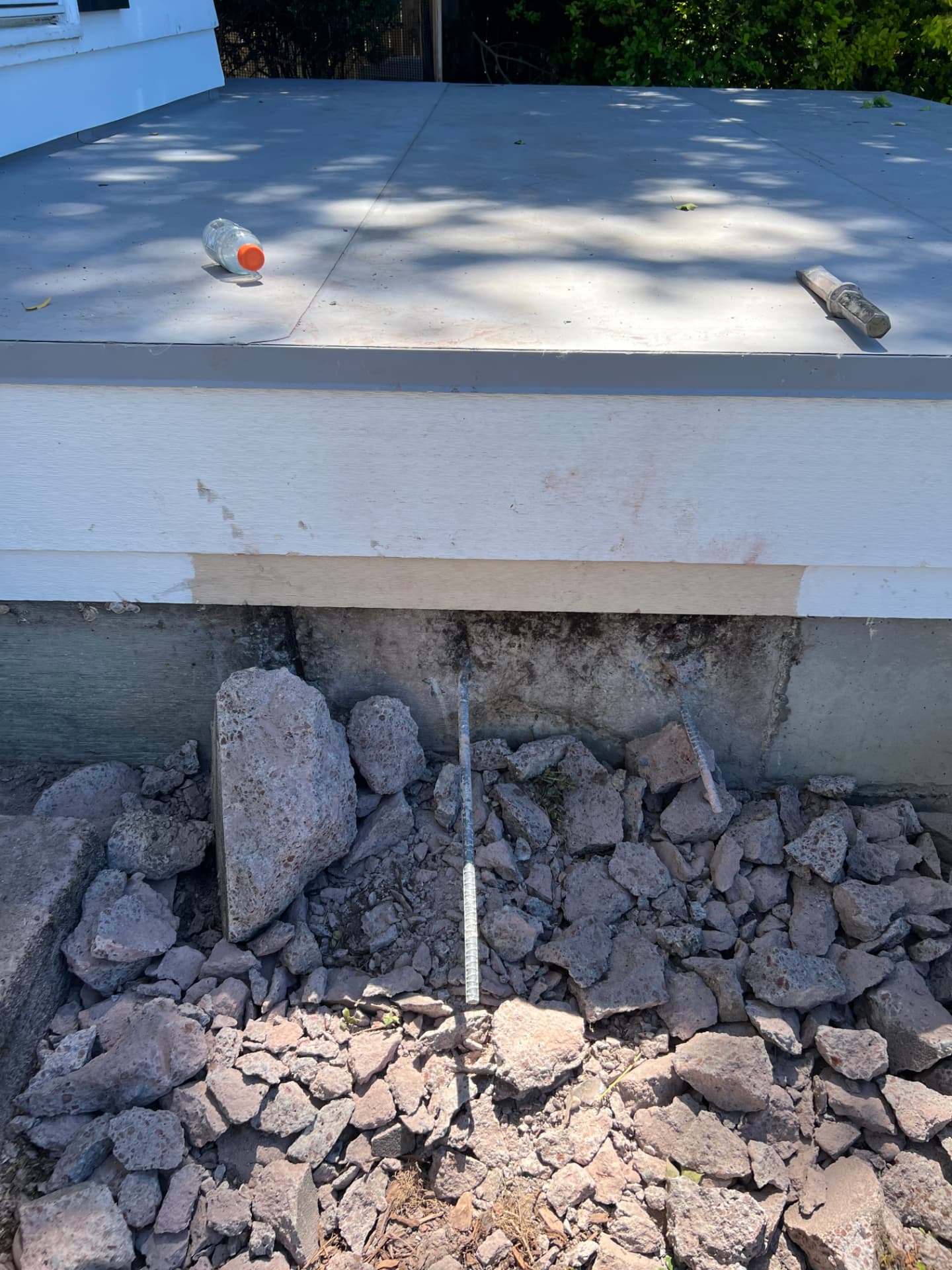 Concrete stairs broken up and stacked for haul away after demolition